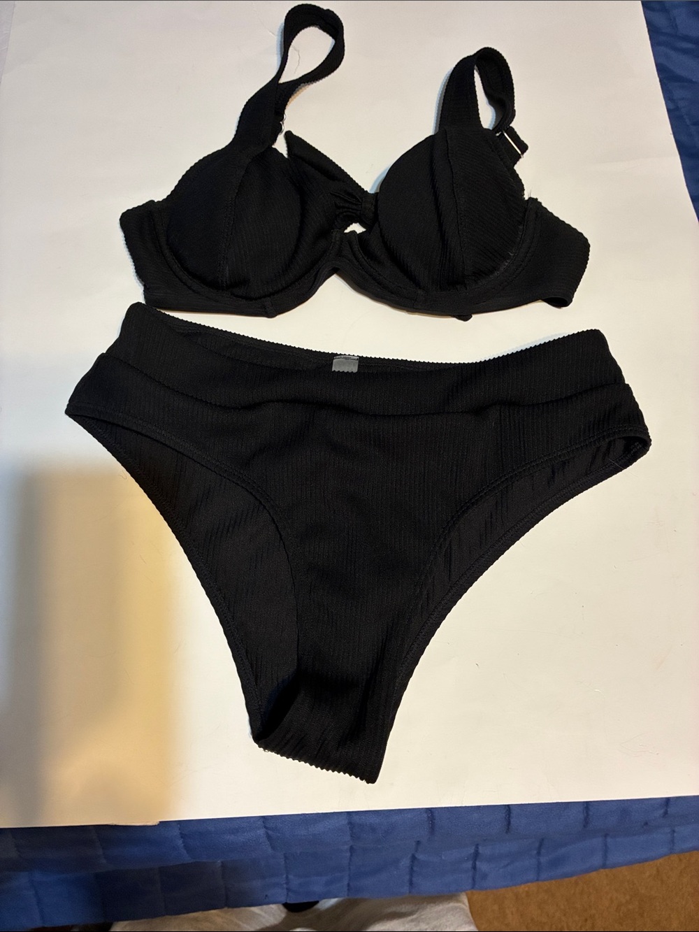 Black Two-Piece Ribbed Bikini Set. Cheeky, underwire, removable padded cup.